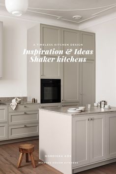 a kitchen with gray cabinets and an island in front of the countertop is shown