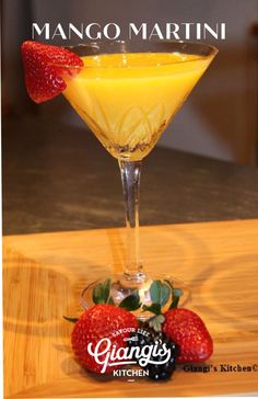 the mango martini is garnished with strawberries