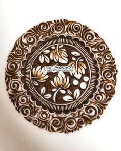 an intricately designed wooden plate with the words, love is in bloom on it