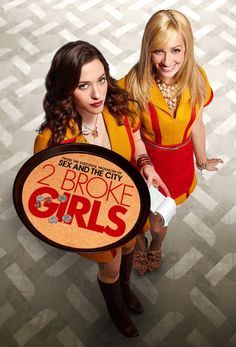 two women in yellow and red outfits holding a sign that says 2 broke girls on it