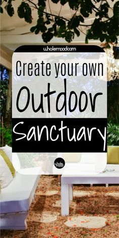 a white couch sitting under a tree next to a sign that says create your own outdoor sanctuary