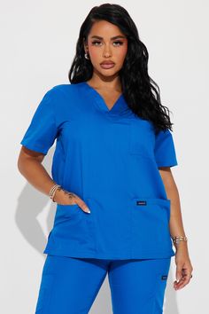 Available In Charcoal And Royal. Uniform Scrub Set V Neck Scrub Top Chest Pocket With Pen Slot 2 Deep Patch Pockets Breathable Fabric Straight Leg Scrub Pant With Cargo Pockets Drawstring Waistband 55% Cotton 45% Polyester Imported California Proposition 65 WARNING: Cancer and Reproductive Harm - www.P65Warnings.ca.gov. | Checking In Cotton Blend Uniform 2 Piece Scrub Set in Royal size Small by Fashion Nova Scrubs Uniform Cute, Royal Uniform, Leg Scrub, Scrubs Uniform, Scrub Sets, Scrub Pants, Gal Gadot, Scrub Tops, Drawstring Waistband