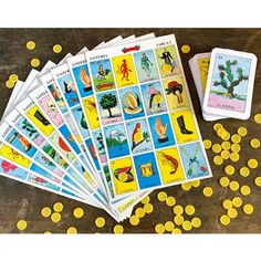 several cards with images of people and animals on them, all in different colors are scattered around