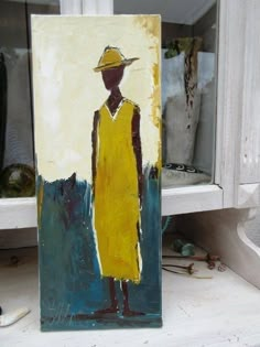 a painting of a person in a yellow dress and hat on a window sill