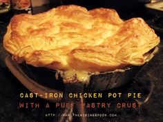 a cast iron chicken pot pie with a puff pastry crust