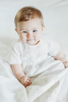 This little darling is wearing a Christening Gown made from her Grandma's wedding dress. Trust the experts at Unbox the Dress to transform your special family wedding gowns into new designs that can be cherished! Family Wedding