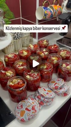 several jars filled with food sitting on top of a table