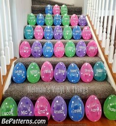 colorful easter eggs are lined up on the stairs for an easy way to decorate them