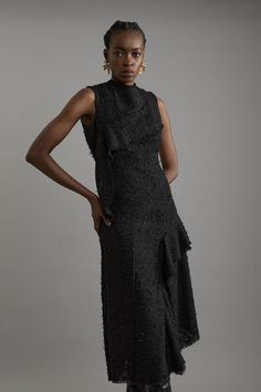 Elevate Your Evening Wardrobe With Our Asymmetric Dress, Made With Boucle, Flecked With Shimmering, Metallic Details. The Flared, Ruffled Skirt Brings The Drama While The Frayed Hemline Adds An Edge. Style It With Strappy Heels For An Occasion Look That Is Guaranteed To Turn Heads Wherever You Step. Metallic Boucle Tailored Sleeveless Asymmetric Midaxi Dress High Quality, Textured Boucle Fabric Subtle Metallic Detailing Flared, Asymmetric Skirt Fit And Flare Silhouette Edgy, Frayed Hemlines Zip Petite Wedding Guest Dresses, Plus Size Workwear, Asymmetric Skirt, Asymmetric Dress, Tall Dresses, Midaxi Dress, Petite Coat, Ruffled Skirt, Boucle Fabric