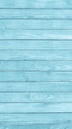 an old blue wood plank wall textured with light blue paint or varnishing