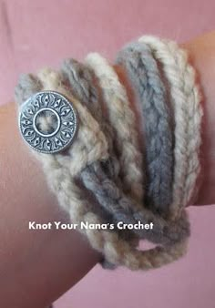 a woman's arm with several bracelets on it and a button that says keep your fingers crochet