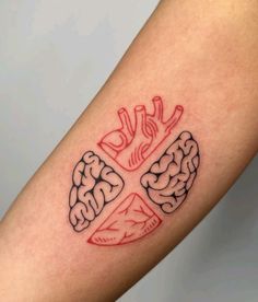 a tattoo on the arm of a person with a cross and brain in the middle