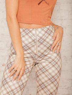 Our Caledonia Plaid Flare Pants are a statement piece that blends retro vibes with modern comfort! Featuring a high-rise fit and ultra-comfy feel, these plaid pants hug your waist and flare out at the hem for a flattering silhouette. Pair them with a fitted turtleneck and booties for a stylish day out or dress them up with a sweater for a fun fall event. Details High Rise Front Zipper No Pockets Plaid Print Fit & Flare Style Ultra Comfy 29 1/2" Inseam Size recs: 0-2 Small, 4-6 Medium, 8 Large, 10 X-Large Provides minimal stretch Model is 5'8" wearing a size Small Plaid Flare Pants, Quilted Outerwear, Fall Wedding Guest, Fitted Turtleneck, Event Details, Skirt Co Ord, Pants Large, Jumpsuit Shorts Rompers, Plaid Pants