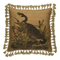 a decorative pillow with a bird on it