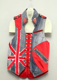 DENIM VEST UK FLAG , UNIQUE PRODUCT, COTTON DENIM MATERIAL, SIZE M/50, PRODUCT DIMENSIONS : CHEST 94CM, WAIST 92CM, HIP 96CM, LENGTH 65CM, PRODUCT CODE MBA015 http://razvandumitran.ro/shop/man-clothes-c-237/denim-vest-uk-flag-p-491.html We are a team of specialists in the field of fashion design. We have formed in artistic schools, and we have worked with specialists in the field. We are approaching the fashion field with new and original creations that surely will attract your eyes where you we Cheap Denim Streetwear Vest, Red Cotton Vest For Streetwear, Punk Denim Vest, Blue Recycled Denim Vest With Pockets, Fitted Patchwork Denim Vest, Fitted Punk Denim Vest, Mens Fashion Denim, Man Clothes