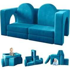 a baby sitting on top of a blue couch next to other furniture and decor items