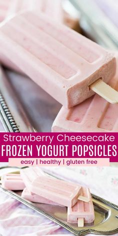 strawberry cheesecake frozen yogurt popsicles on a metal tray with text overlay that reads, strawberry cheesecake frozen yogurt popsicles