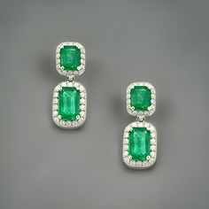 Natural Finely Faceted Quality Emerald and Diamond Earrings set in 14k white Gold with 3.48 TCW Certified $7,950 310551This is a Unique Custom Made Glamorous Piece of Jewelry!These stunning earrings feature natural, finely faceted emeralds paired with sparkling diamonds. Set in 14k white gold, each earring showcases two vibrant emeralds, beautifully surrounded by a halo of diamonds for extra brilliance. With a total carat weight of 3.48 TCW, these earrings are as dazzling as they are elegant. GA Emerald Halo Earrings, Emerald Diamond Earrings, Stunning Earrings, Natural Emerald, Emerald Diamond, Sparkle Diamonds, Earrings Set, Earring Set, Diamond Earrings