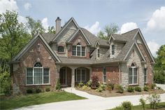 a large brick house with lots of windows