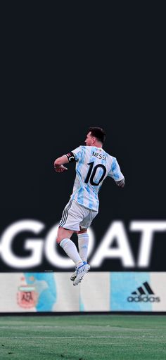 a soccer player is jumping in the air