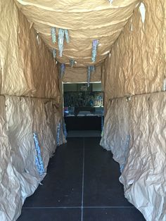 the inside of a tent that is covered in paper