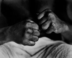 black and white photograph of two hands holding each other