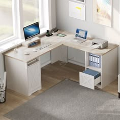 a desk with a computer on top of it in a living room next to a window