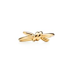 The entwined ends of Tiffany Knot’s signature motif symbolize the power of connections between people. Balancing strength and elegance, each Tiffany Knot design is a complex feat of craftsmanship. This ring is crafted with yellow gold and polished by hand for high shine. Wear on its own or partnered with classic silhouettes for an unexpected pairing. 18k yellow gold; Features Tiffany & Co. hallmark | Tiffany Knot Ring in Yellow Gold, Size: 9 Tiffany Knot Ring, Tiffany Knot, Tiffany Rings, The Bling Ring, Rope Rings, Jewelry Knots, International Jewelry, Life Symbol, Knot Design