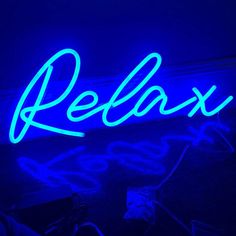 a neon sign that reads relax on it