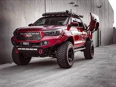 a red truck parked in front of a building