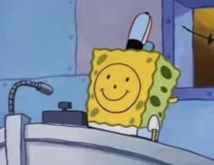 spongebob is sitting in the bathroom sink