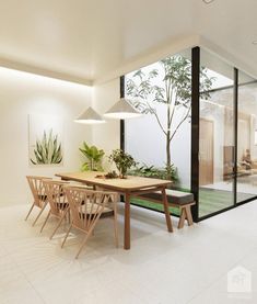 a dining room with a table and chairs next to a wall mounted planter in the corner