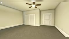 an empty room with a ceiling fan and door