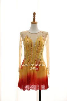 a yellow and red dress on a mannequin