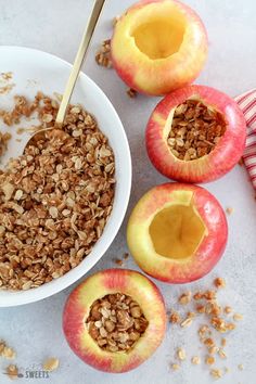 apples and granola in a bowl on a table