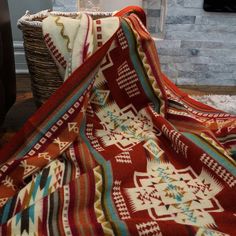 a blanket is laying on the floor next to a fire place