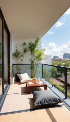 a balcony with couches, tables and potted plants