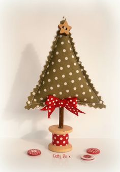 a small christmas tree with polka dots on it