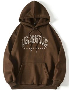 "Introducing our timeless \"Los Angeles\" brown hoodie, where classic style meets West Coast charm. Crafted in a rich brown hue with crisp white lettering, this hoodie is more than just an article of clothing; it's a statement piece that encapsulates the laid-back yet vibrant essence of the City of Angels. The warm brown backdrop serves as a canvas for the bold \"Los Angeles\" lettering in elegant white. It's a design that reflects the city's diversity, creativity, and the seamless fusion of urb Trendy Sweatshirts Hoodie, Brown Hoodie Aesthetic, Trendy Hoodies Women, Hoodies For School, Shein Hoodies, Brown Nike Sweatshirt, Hoodies Shein, Hoodie Print Ideas, Clothes Brown