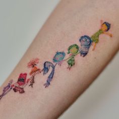 an arm with some cartoon characters on it