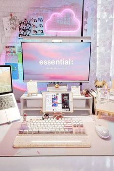 two laptops are sitting on a desk with a monitor and keyboard in front of them