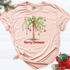 Christmas Palm Tree Beach Shirt, Vacation Family shirt, Summer Hawaiian Holiday Shirt, Family Mele Kalikimaka Tee, Christmas In July Shirt HI! Welcome to my store, I'm delighted to see you here. My store's main goal is to provide you with premium everyday apparel with the best graphic t-shirts. I see you as a friend, not just a customer. I'm sure you'll love my designs. So, here is a brief description for you to-see-the order-process: 1. Please, Check and Review all Photos. 2. Select Your T-Shir Hawaii Tshirt, Palm Tree Shirt, Christmas Palm Tree, Christmas Beach, Palm Tree Beach, Hawaiian Christmas, Vacation Family, Palm Trees Beach, Xmas Tees