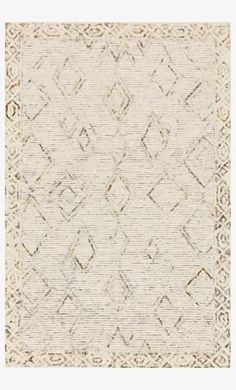 a beige and white rug with an intricate design on the bottom, in front of a white background