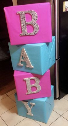 three stacked blocks with the letters b, person, and y on them