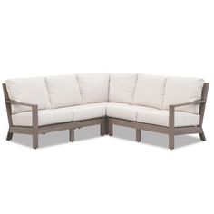 an outdoor sectional sofa with white cushions and wood frame, in front of a white background