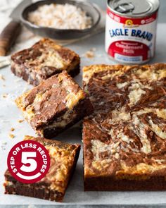 brownies cut into squares on top of a table next to a can of eagle brand