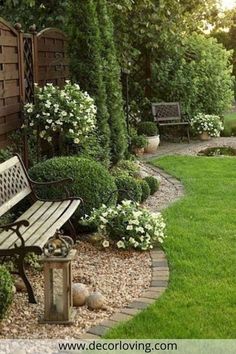 a wooden bench sitting in the middle of a garden