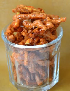 a glass container filled with candies on top of a table