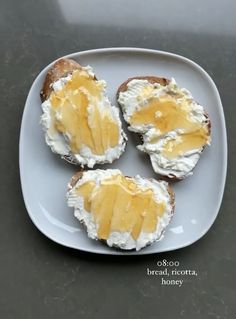 four pieces of bread with spread on them