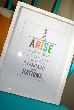 there is a framed poster on the back of a chair that says, arise